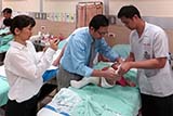Dr Amnuay fitting casts - Click for larger image