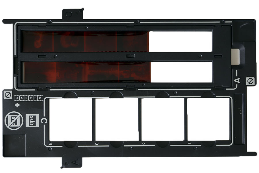 Transparency holder for 35mm film and mounted slides