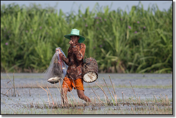 Fisherman at Thale Noi