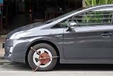 Illegally parked cars are clamped - Click for larger image Illegally parked cars are clamped - Click for larger image