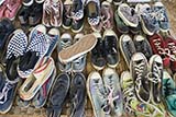 Second-hand shoes for sale at the Saturday market in Klong Ngae - Click for larger image