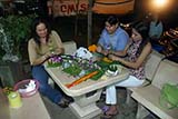 Women making gratongs, Hat Yai - Click for larger image Women making gratongs, Hat Yai - Click for larger image