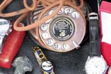 Old telephone and watches at Greenway market - Click for larger image