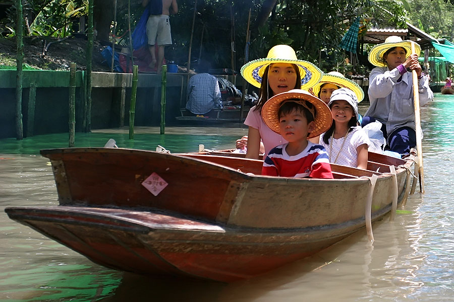Tourists at Thailand's famous floating market in Damnoen Saduak