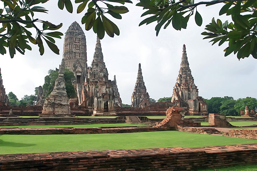 The lush green grass, red brickwork and beautiful architecture of the temples of Ayuthaya