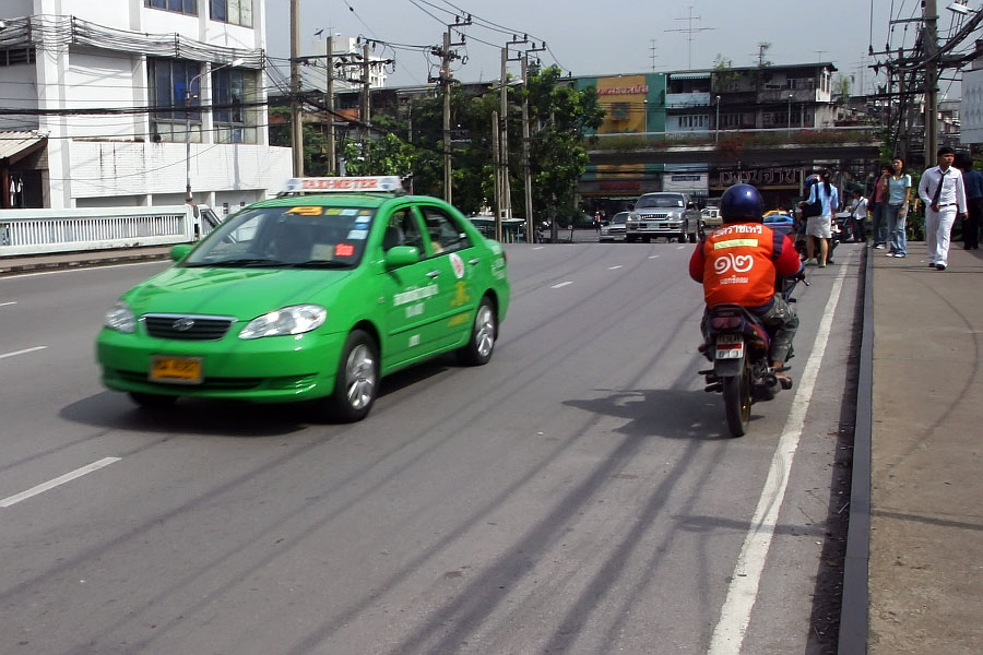 Motorcyclist in Bangkok going the wrong way along a one-way street