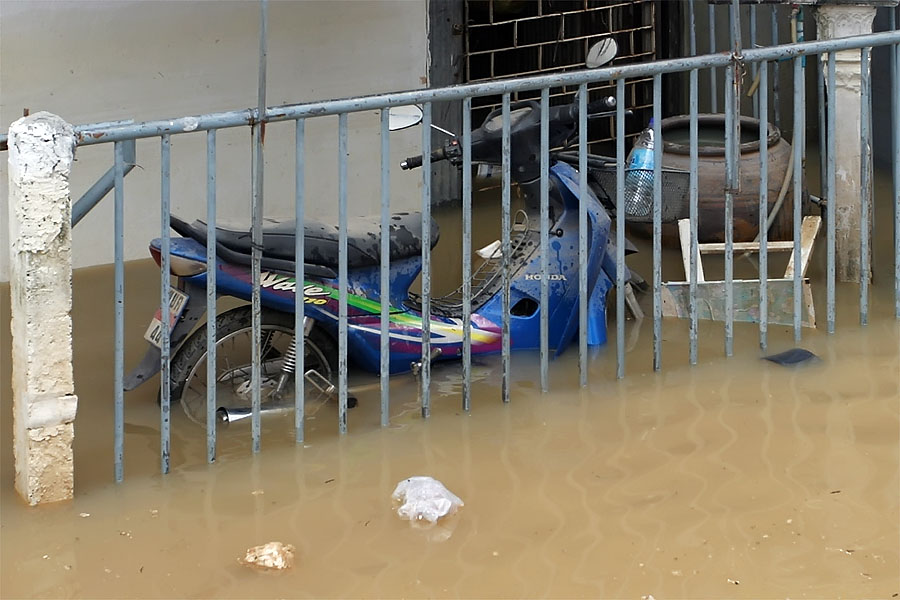 Partially submerged motorbike as a result of the Hat Yai flood