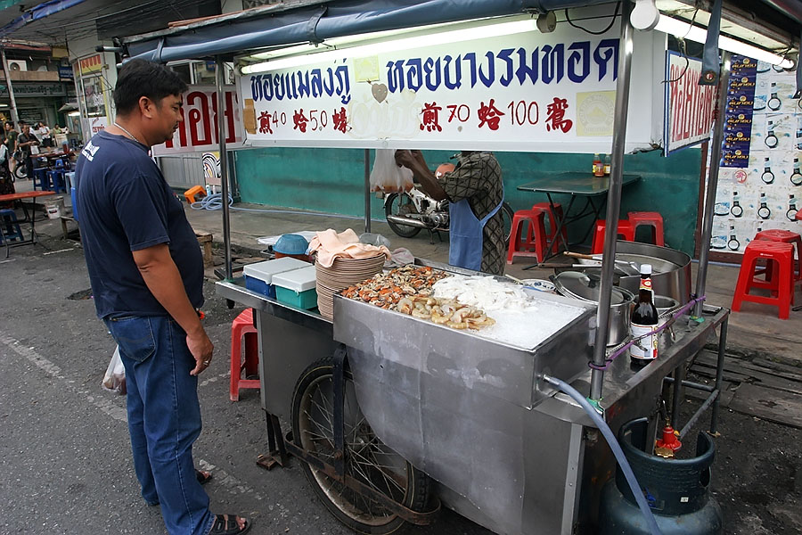 Street vendor selling deep fried shellfish