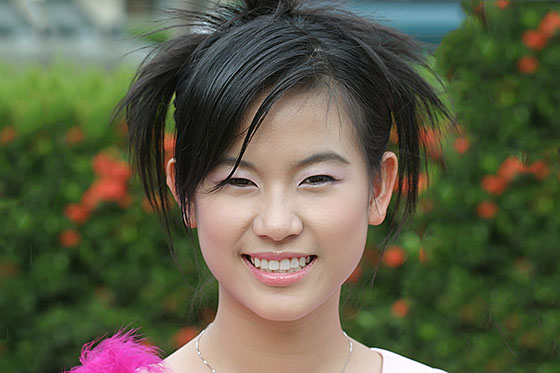 Pretty Thai university girl taking part in the Loy Gratong festival