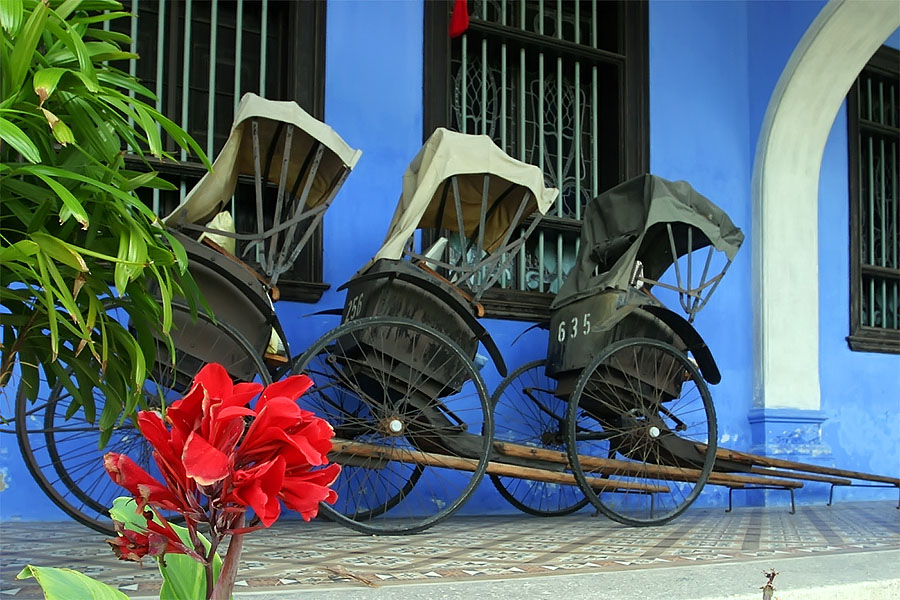 Rickshaws outside the Cheong Fatt Tze Mansion in Georgetown, Penang, Malaysia