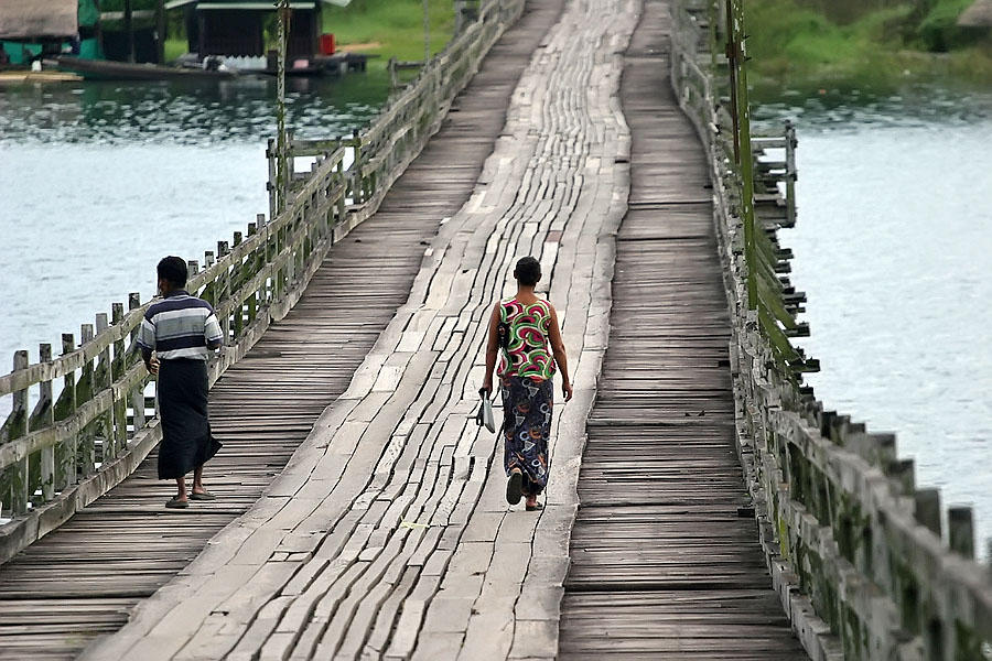 Some locals crossing the Sangkhlaburi wooden footbridge