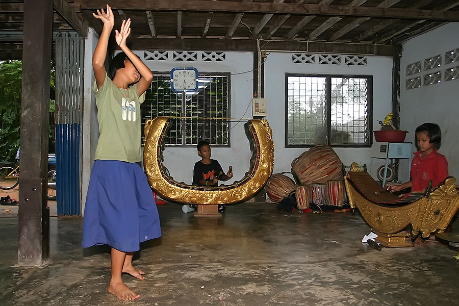 Mon children playing traditional instruments and practising tradtional dancing