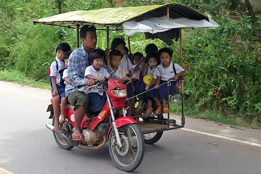 Mon children on their way home from school