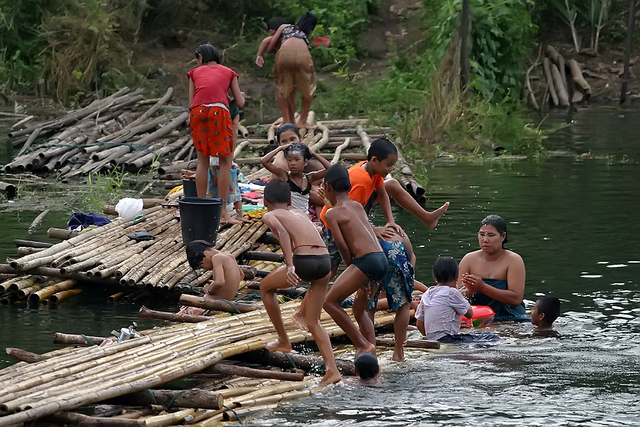 Local Mon people bathing in the river