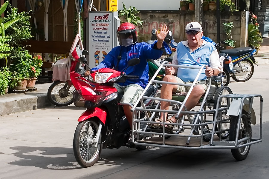Disabled farang in Chiang Rai on a homemade sidecar