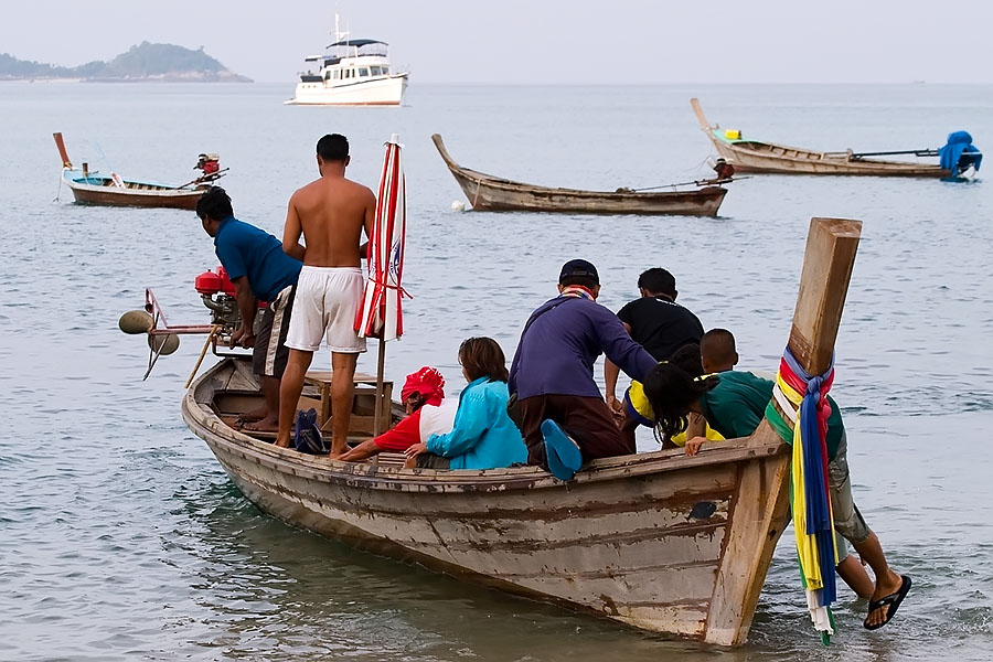 Amidst the drunkenness and debauchery, normal Thai life manages to continue