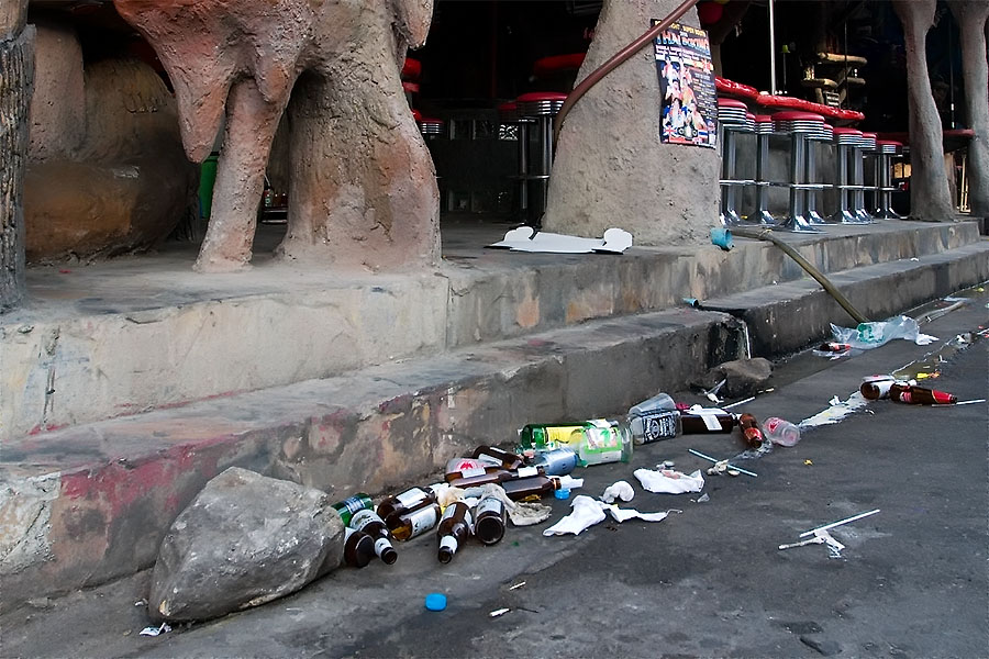Trash from the night before outside a filthy Patong bar area