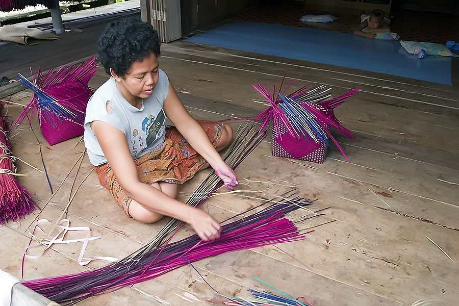 Making bags from dyed reeds harvested from Thale Noi, Phattalung province, Thailand