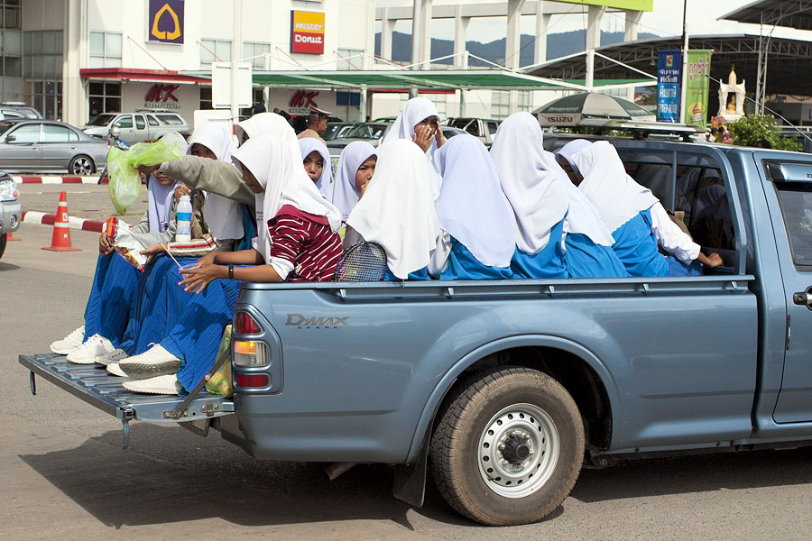 Muslim girls on a pickup truck