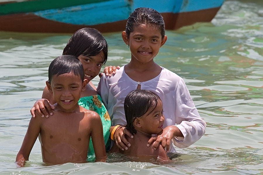 Muslim children playing in the sea at Kao Seng, Songkhla