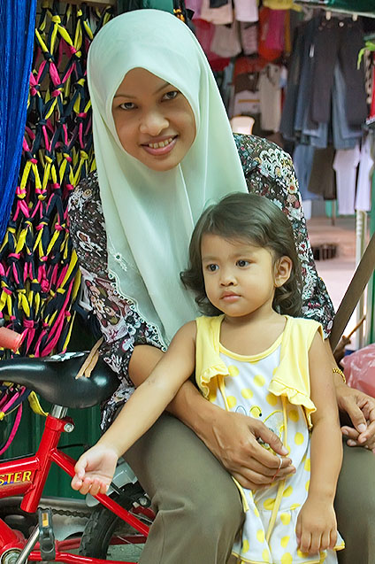 Muslim girl with her young daughter