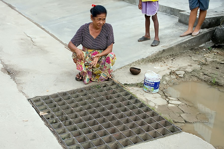 Fishing in a storm drain in Mae Sot