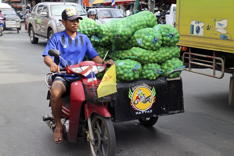 Using a motorbike to take produce to the local fresh market
