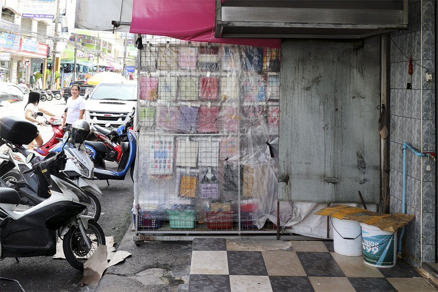 A shop that has been extended using the full width of the footpath