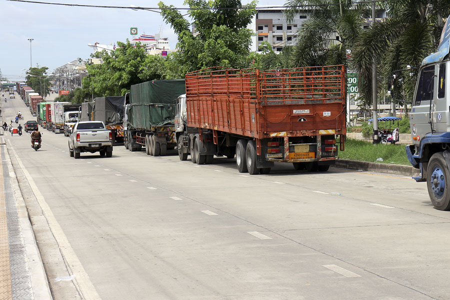 Huge line of trucks waiting to cross the border into Malaysia in Dannok, Thailand