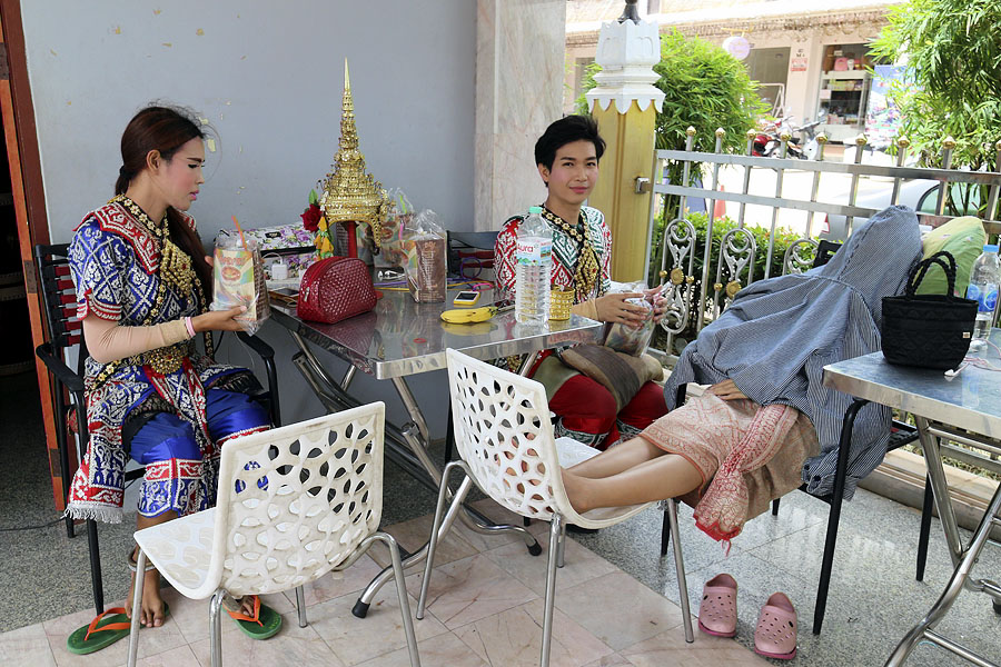 Thai dancers waiting to be paid to perform at the Asian Cultural Village, Dannok