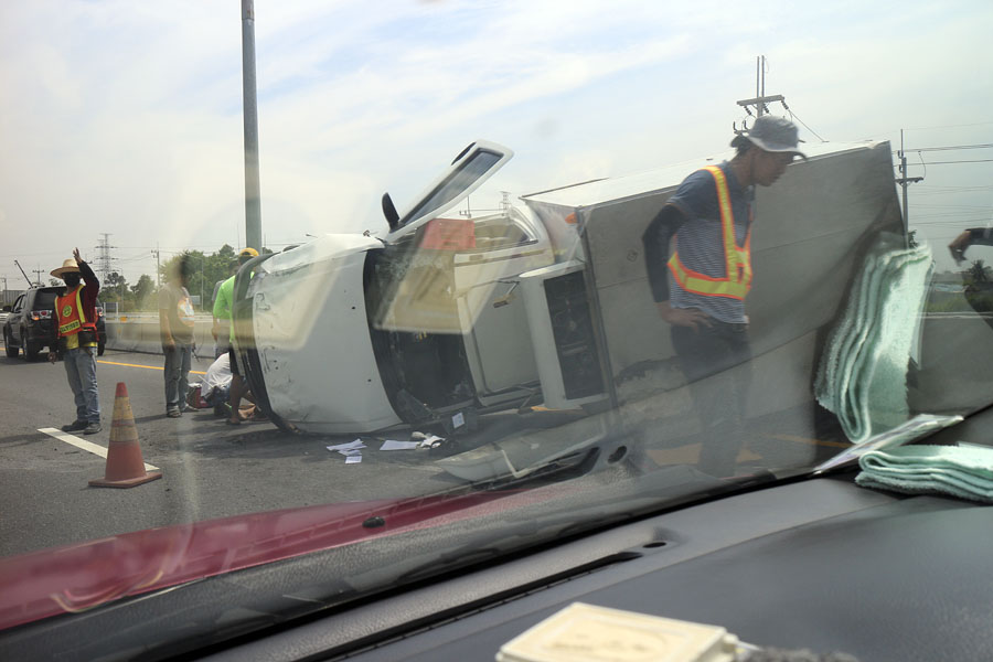Pickup truck on its side on the Bangkok to Pattaya motorway