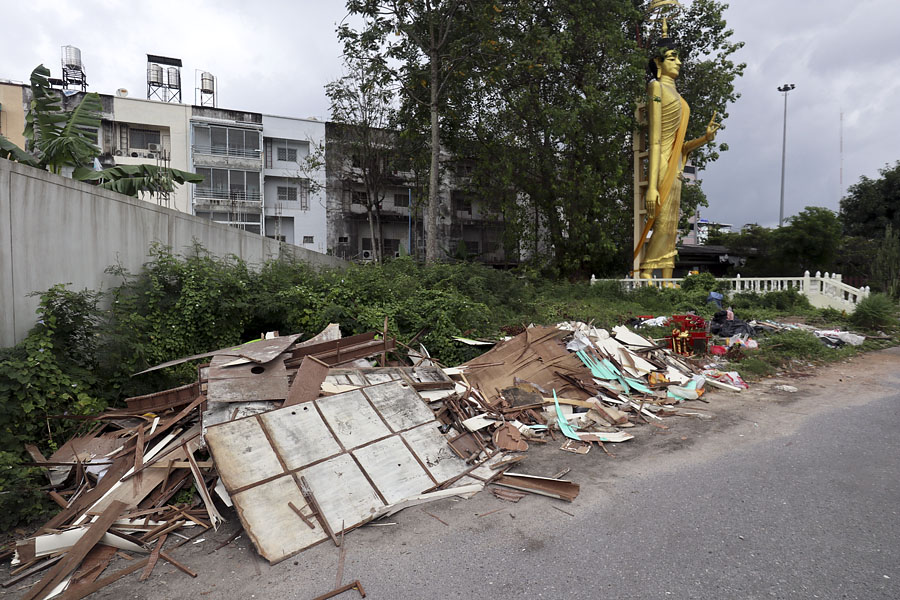 Illegal fly-tipping next to an image of the Buddha