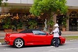 Ferrari owner getting a parking ticket in Singapore - Click for larger image