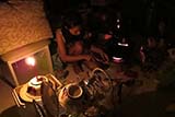 Cooking by candlelight while we were trapped upstairs without electricity - Click for larger image