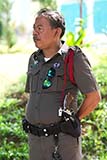 Cop overseeing a merit-making ceremony at a rural temple - Click for larger image