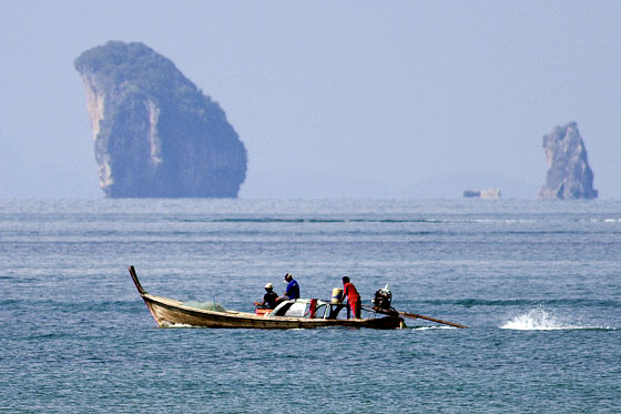 Limestone karsts and longtail boat, Krabi