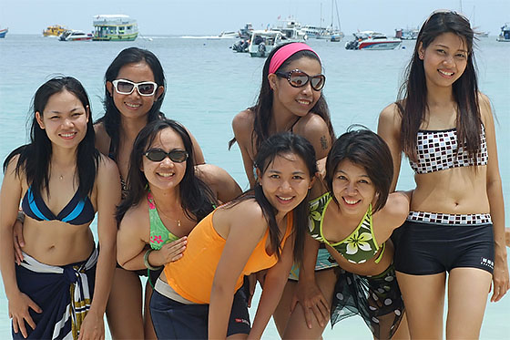 Thai girls at the beach - one is a good friend of mine, but not the one you are staring at